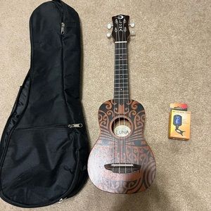 Ukulele brand new, never used.  Comes with bag and tuner
